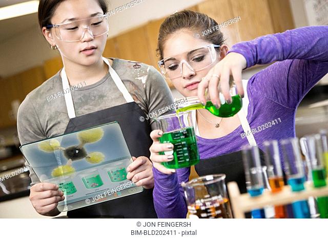 Students working with chemicals in classroom