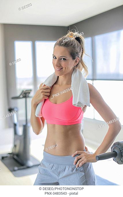 Portrait of a pretty woman in fitness center