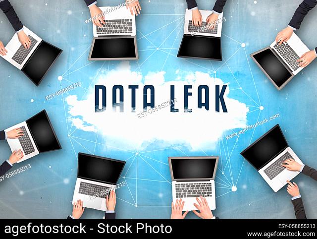 Group of people having a meeting with DATA LEAK insciption, web security concept