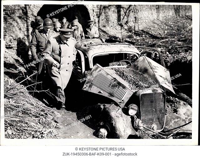 Mar. 06, 1945 - Mr. Churchill in Germany visit to famous citadel in Julicil.: Photo shows Mr. Churchill passes a Damaged German car in the famous Citacel in...