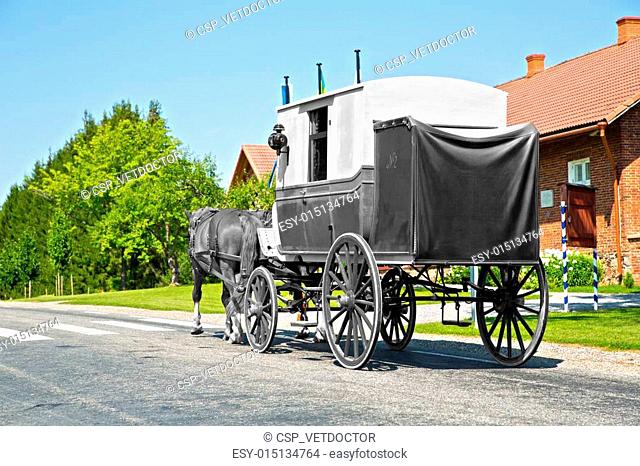 Wagon on road is shaded form background