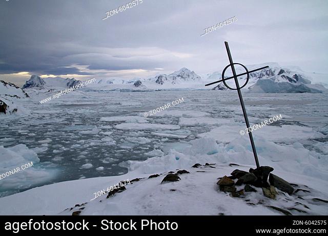 burial place against the backdrop of the Antarctic Peninsula and the Strait Pinola on a cloudy winter day
