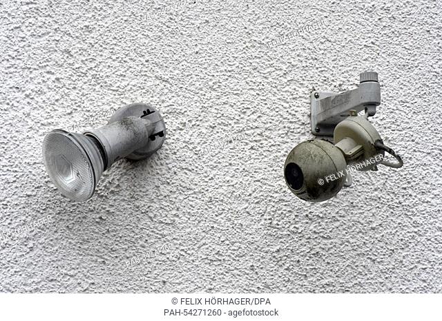 A surveillance camera (R), attached to a residential home, monitors the surrounding area in Pullach im Isartal, Germany, 6 December 2014