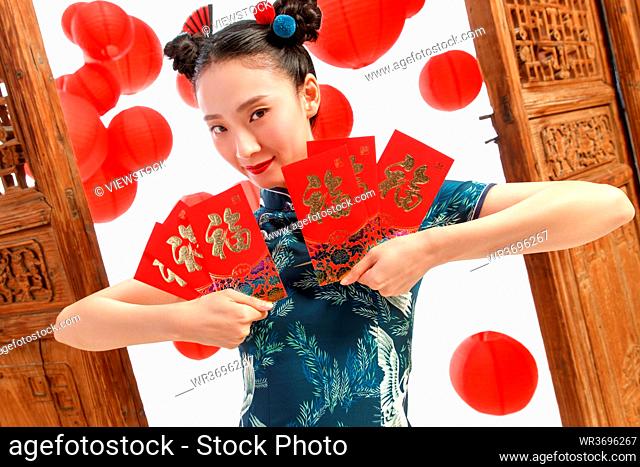 The New Year happy woman with a red envelope
