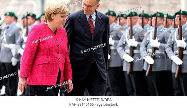 German Chancellor Angela Merkel welcomes Prime Minister of Italy Enrico Letta with military honours at the Federal Chancellery in Berlin,  Germany