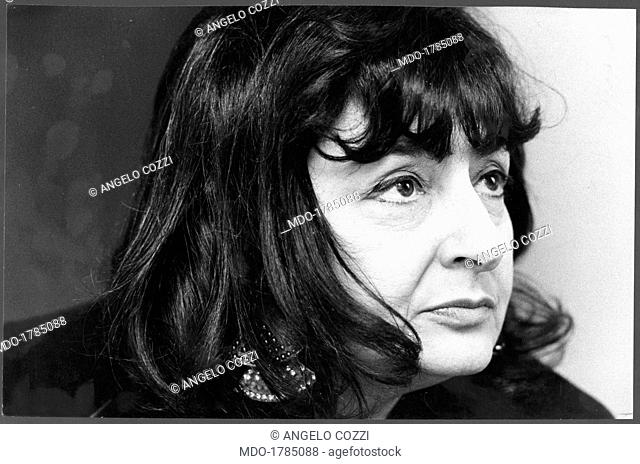 Titina Maselli posing. Italian painter Titina Maselli posing in her atelier in Paris. Paris, 1975