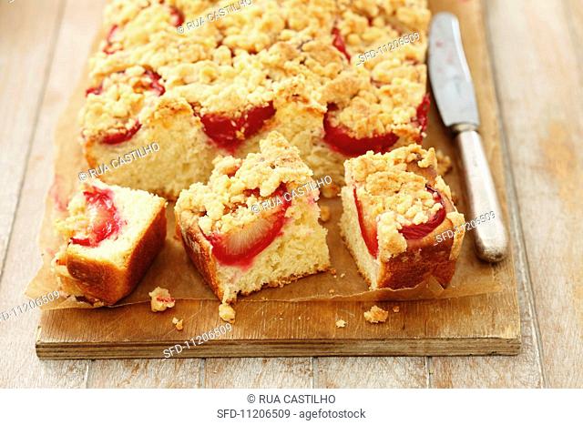 Plum crumble cake, partly sliced
