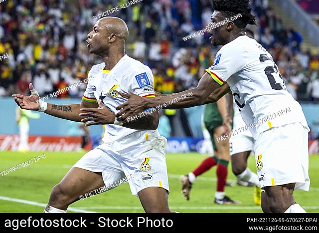 24 November 2022, Qatar, Doha: Soccer: World Cup, Portugal - Ghana, Preliminary Round, Group H, Matchday 1, Stadium 974, Ghana's André Ayew (l) celebrates with...
