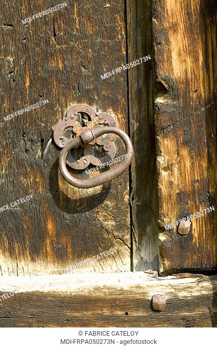 St Veran, the highest village in Europe - Old handle or knocker in iron of wood door in Queyras