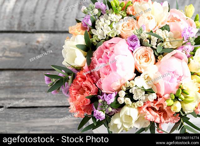 luxurious and elegant bouquet of roses and Other flowers. Composition colors on gray background. Copy space