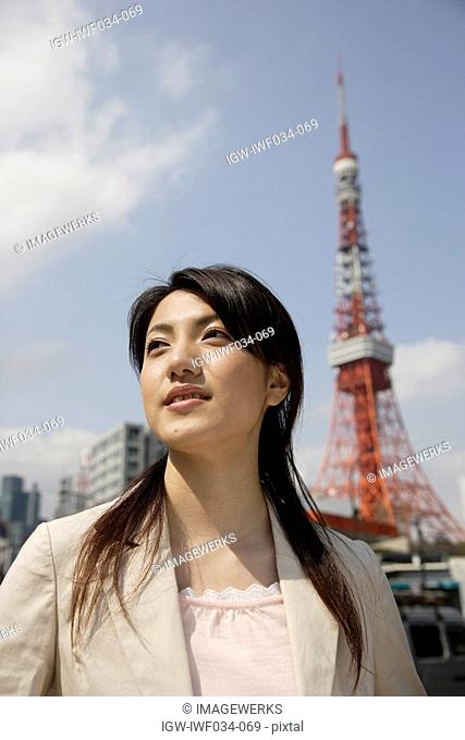 Low angle view of a young woman looking away