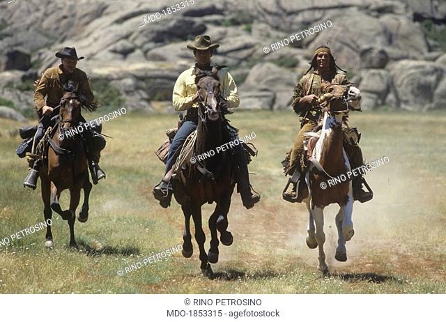 Italian actor Carlo Mucari, Austrian actor William Berger and Italian actor Giuliano Gemma riding their horses in a scene from the film Tex and the Lord of the...