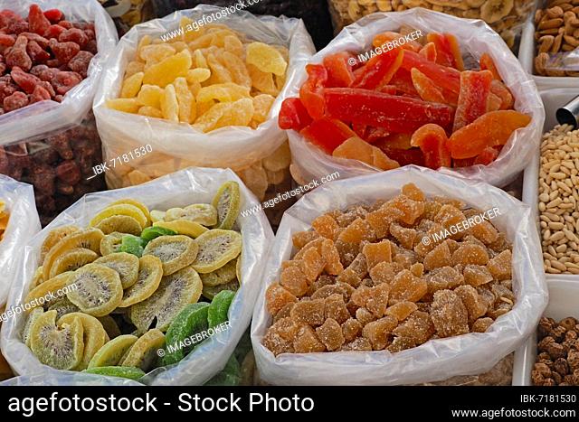 Plastic bags of glazed fruit, dried fruit, icing, glazed fruit, market stall, glazed kiwi, glazed ginger, glazed pineapple, fruit stall, Spain, Europe