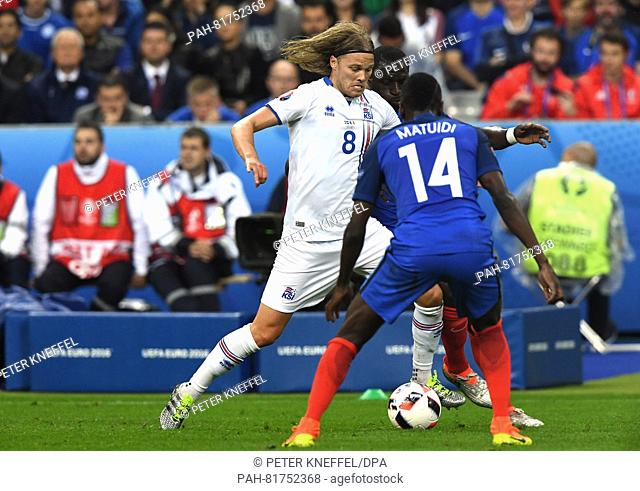 France's Blaise Matuidi and Iceland's Birkir Bjarnason during the UEFA EURO 2016 quarter final soccer match between France and Iceland at the Stade de France in...