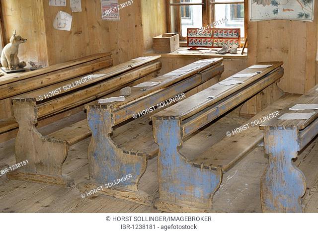 Historic single-class school benches with school books and teaching aids, early 20th century, originally from South Tyrol, Museum of Tyrolean Farms, Kramsach