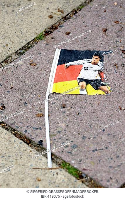 German flag with the soccerplayer Ballack on a street after the worldchamionship in Berlin, Germany