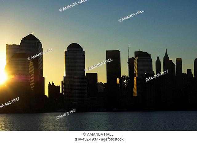 Lower Manhattan skyline at sunrise across the Hudson River, New York City, New York, United States of America, North America