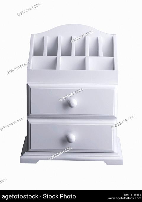 White wooden casket with shelves with drawers. A small cabinet for cosmetics
