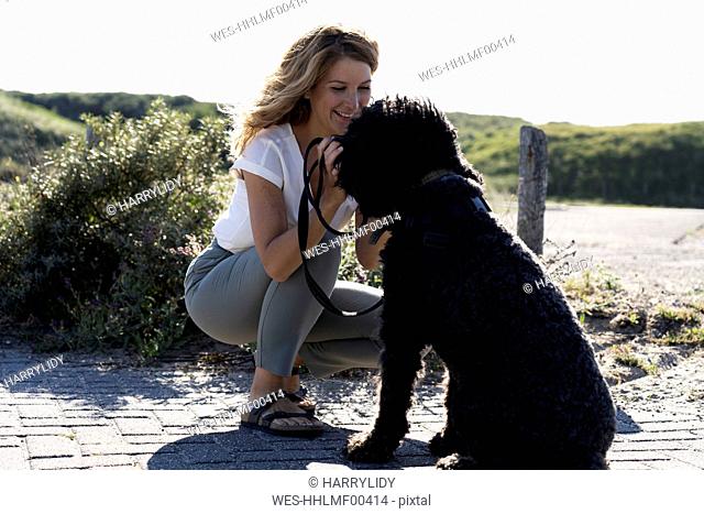 Woman petting her dog