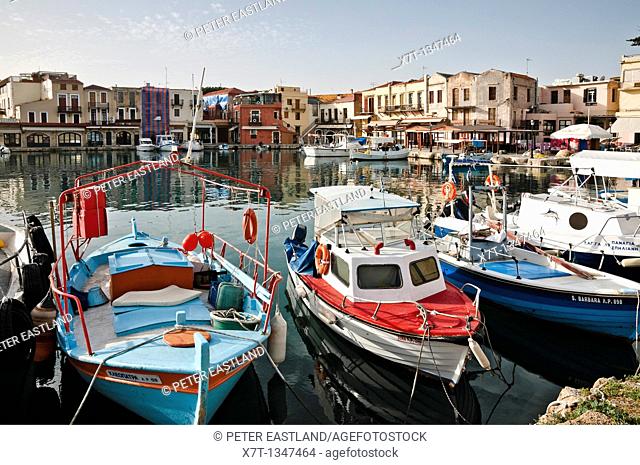 Early morning in the old harbour at Rethymnon on the island of Crete, with its colourful Venetian and Ottoman buildings