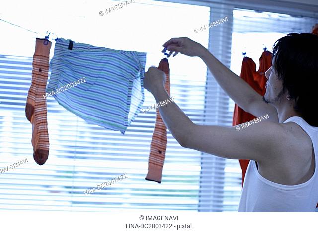 Man Hanging Laundry