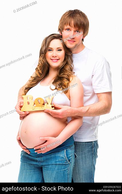 Young parents expecting their baby boy. Pregnancy. Isolated over white background