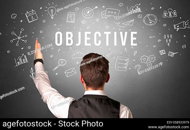 Rear view of a businessman with OBJECTIVE inscription, modern business concept