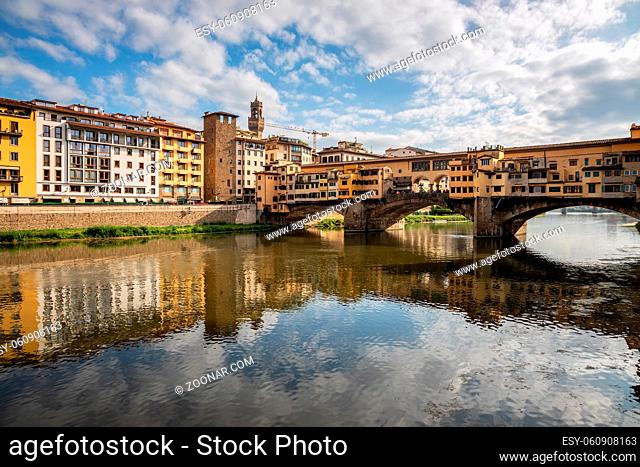 FLORENCE, TUSCANY/ITALY - OCTOBER 20 : Ponte Vecchio across the River Arno in Florence on October 20, 2019. Unidentified people