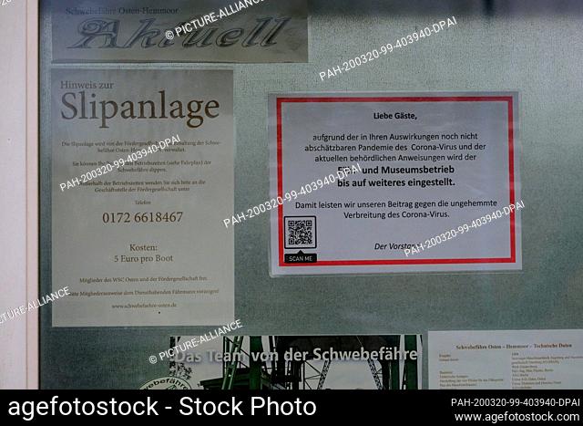 19 March 2020, Lower Saxony, Osten-Hemmoor: A sign informs about the discontinuation of the ferry and museum operation of the 111-year-old floating ferry due to...