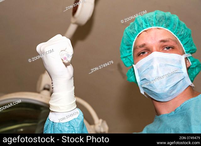 Surgeon making opiate injection before coming difficult surgery