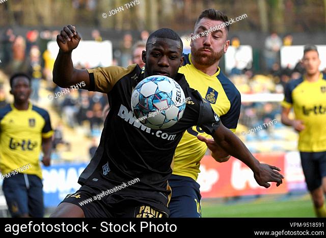 STVV's Mory Konate and Union's Christian Burgess fight for the ball during a soccer match between Royale Union Saint-Gilloise and Sint-Truidense VV