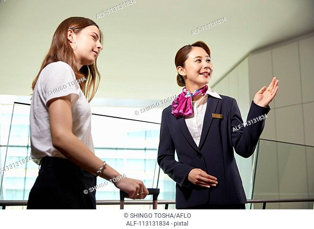 Japanese Flight Attendant helping customer