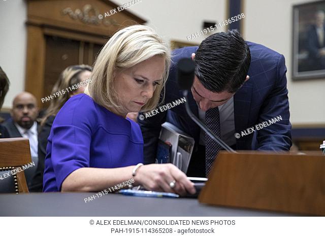 United States Homeland Security Secretary Kirstjen Nielsen speaks with an aide prior to her testimony before the House of Representatives Judiciary Committee on...