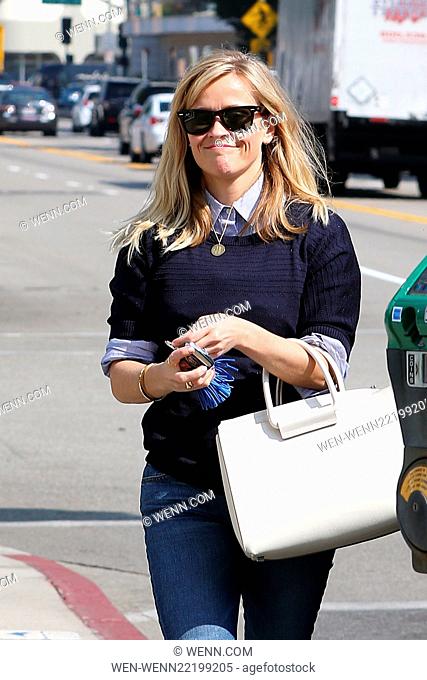 Reese Witherspoon heads for a skin care appointment followed by a visit to her office in Beverly Hills. She wore skinny tight jeans