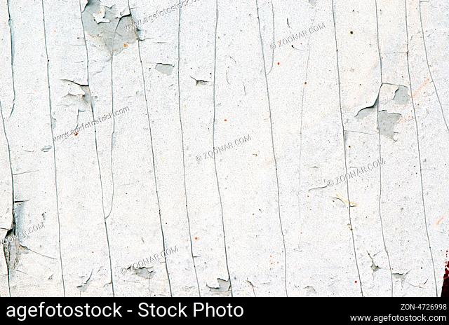 background of grunge old white peeled paint remain on plywood wall