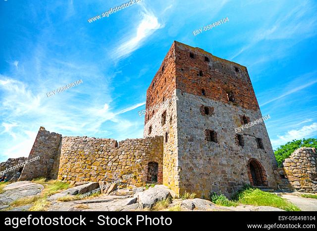 Castle ruin under a blue sky in the summer with many windows