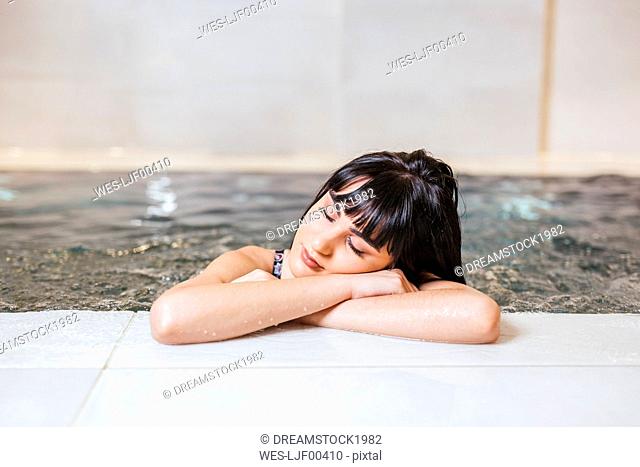 Young woman enjoying the whirlpool in a spa