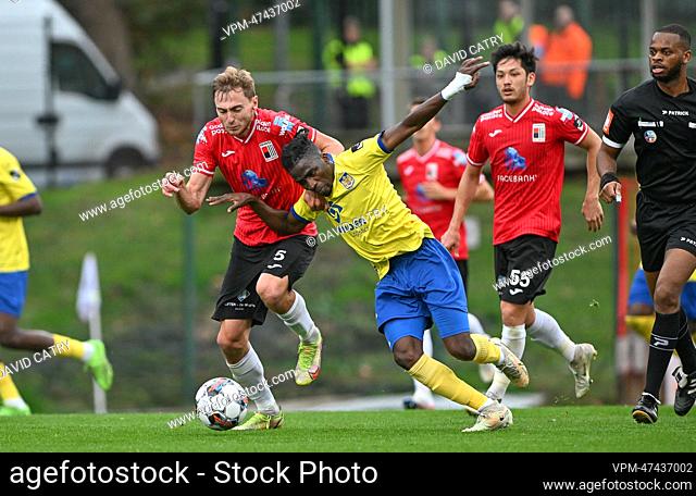 Rwdm's Yan Vorogovskiy and Beveren's Taofeek Ismaheel fight for the ball during a soccer match between RWDM Molenbeek and SK Beveren