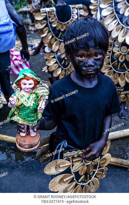 Local Children â. . Blacked Upâ. . In Tribal Costume Parade Through The Streets Of Kalibo Holding Santo Nino Statues During The Ati-Atihan Festival, Kalibo