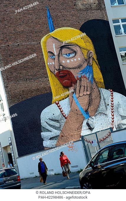 A large graffiti by Brazilian artist Nunca is seen on a facade of a building in the city centre of Frankfurt Main, Germany, 04 September 2013