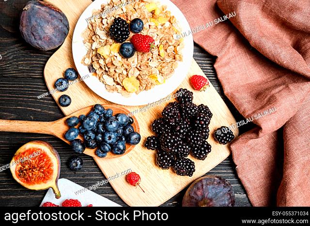 Healthy breakfast with muesli and berries. Top view, flat lay