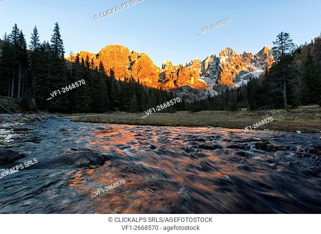 Autumn sunset illuminates the high peaks. Venagia Valley Panaveggio Natural Park Dolomites Trentino Alto Adige Italy Europe