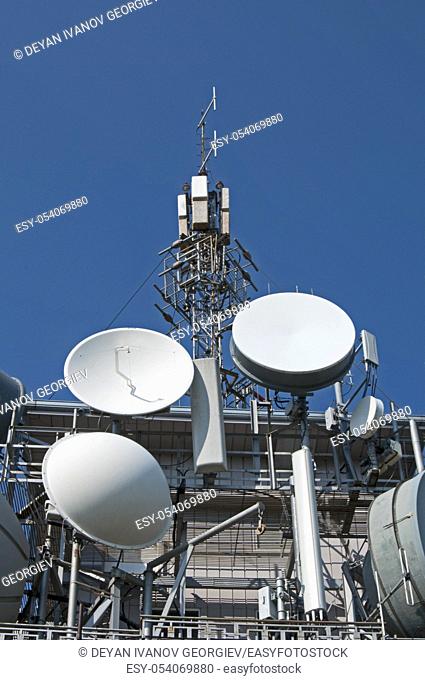 Transmitters, antennas and repeaters on building