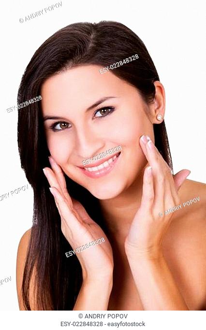 Young woman applying beauty product