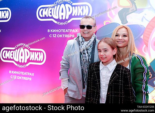 RUSSIA, MOSCOW - OCTOBER 10, 2023: Singer Vladimir Levkin and actress Marina Ichetovkina with their daughter Nika attend the premiere of the animated film...