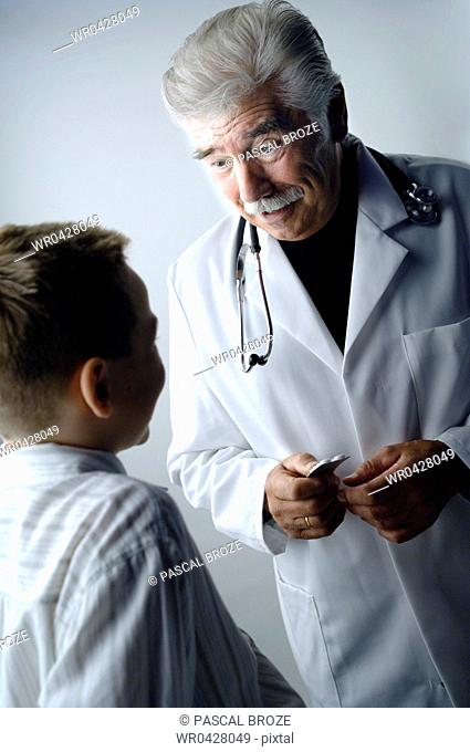 Close-up of a male doctor and a patient looking at each other