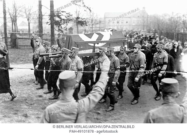 SA (Sturmabteilung) members carry the coffin, covered with a Nazi flag, of their comrade Walter Thriemer, who was killed in street fighting for the so-called...