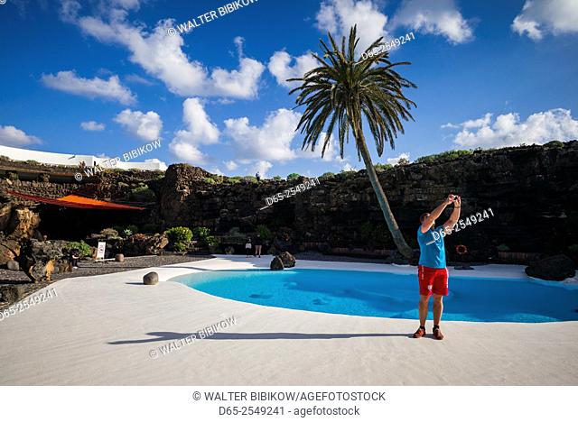 Spain, Canary Islands, Lanzarote, Jameos del Agua, complex inside old lava tube, designed by Cesar Manrique, exterior pool