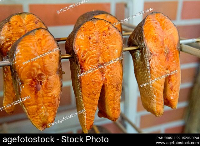 07 May 2020, Mecklenburg-Western Pomerania, Koserow: Salmon as smoked fish fresh from the smoking oven, taken in Kosreow on the island of Usedom