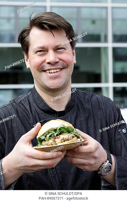Dirk Alberts, owner of the restaurant 'Grill-Kontor', presents a quinoa burger before the gastronomy fair 'Internorga' in Hamburg, Germany, 16 March 2017